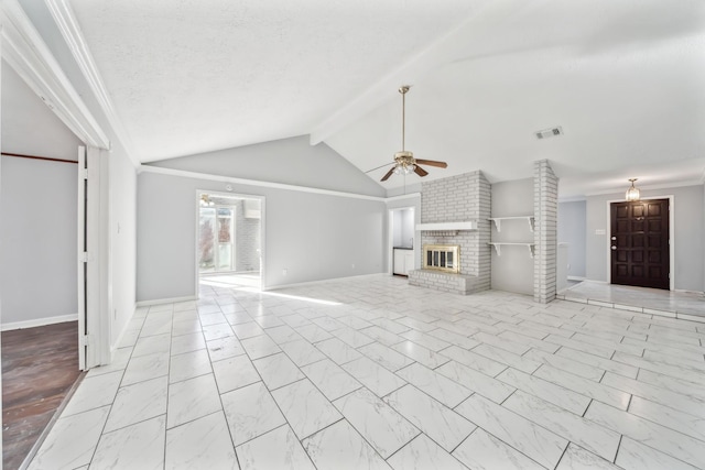 unfurnished living room featuring a brick fireplace, a textured ceiling, lofted ceiling with beams, and ceiling fan