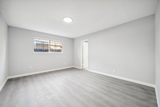 spare room with hardwood / wood-style floors