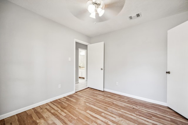 unfurnished room featuring ceiling fan and light hardwood / wood-style flooring