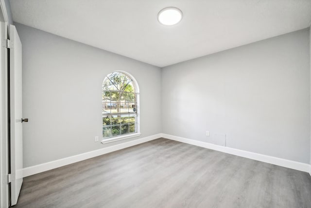 empty room featuring hardwood / wood-style flooring