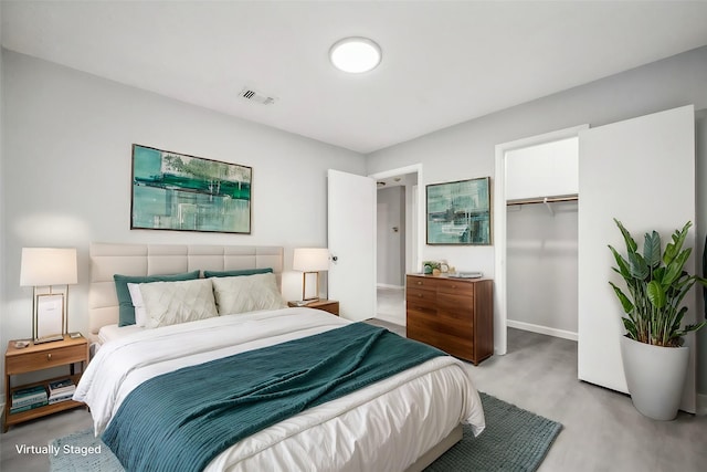 bedroom featuring a closet and a walk in closet