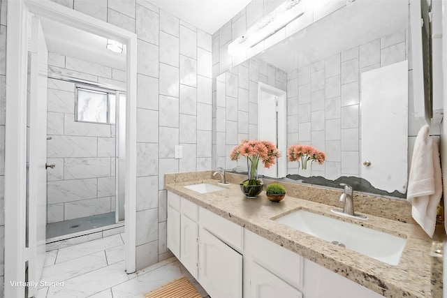 bathroom featuring vanity, tile walls, and a shower with door