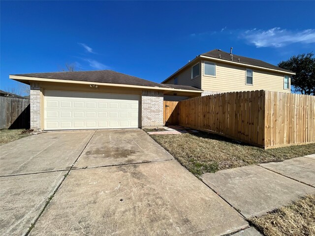 view of side of home with a garage