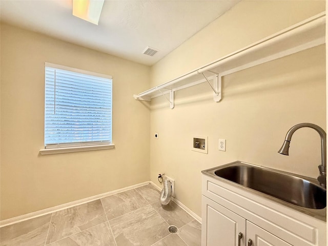 laundry room featuring cabinet space, visible vents, hookup for an electric dryer, washer hookup, and a sink