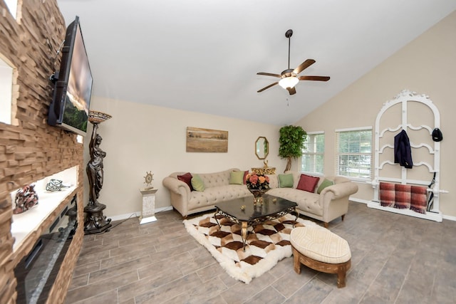 living room featuring ceiling fan and lofted ceiling