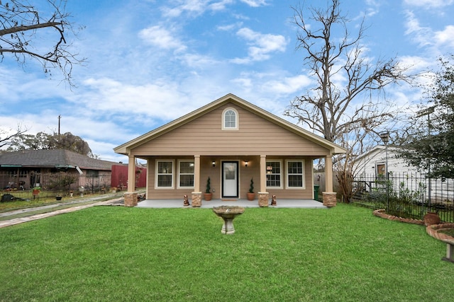 bungalow featuring a front lawn and covered porch