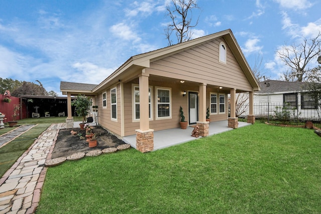 back of house featuring a yard