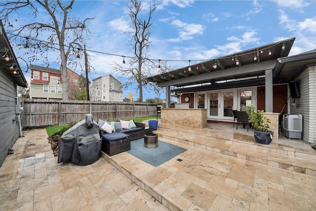 view of patio / terrace with an outdoor living space and french doors