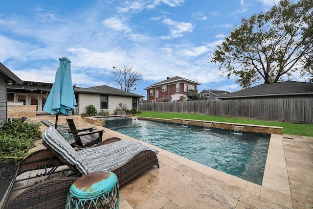 view of swimming pool featuring pool water feature and a patio