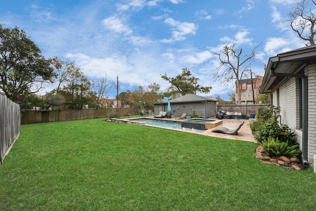 view of yard featuring a pool with hot tub and a patio