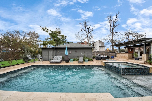 view of pool featuring a patio area and an in ground hot tub