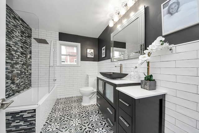 bathroom featuring toilet, vanity, and tile patterned flooring