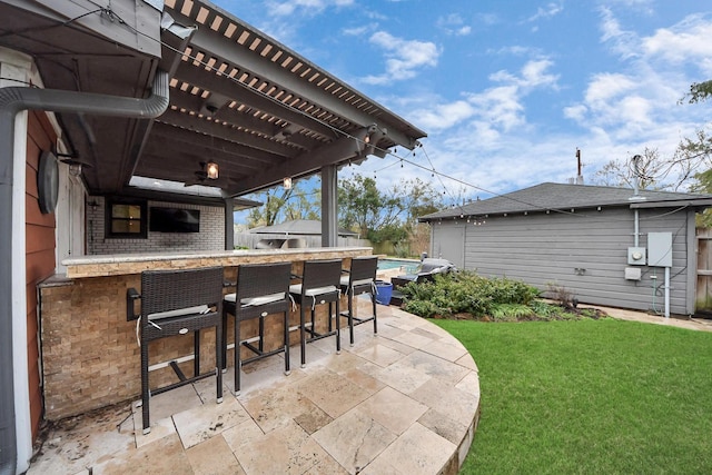 view of patio with an outdoor bar and a pergola