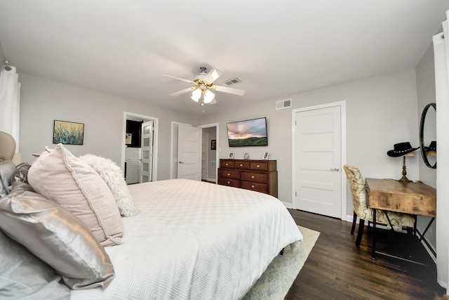 bedroom with ceiling fan and dark hardwood / wood-style flooring