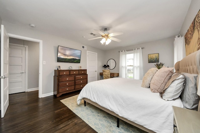 bedroom featuring ceiling fan and dark hardwood / wood-style floors