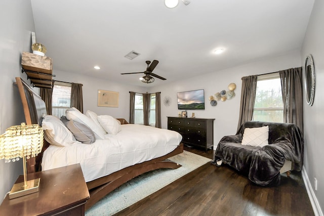 bedroom with ceiling fan and dark hardwood / wood-style flooring