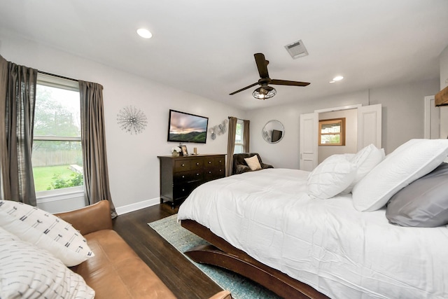 bedroom with dark wood-type flooring and ceiling fan