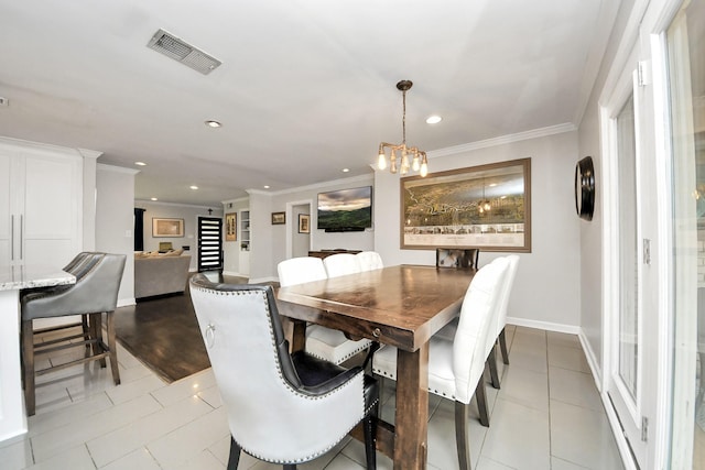 dining area with an inviting chandelier, light tile patterned flooring, and crown molding