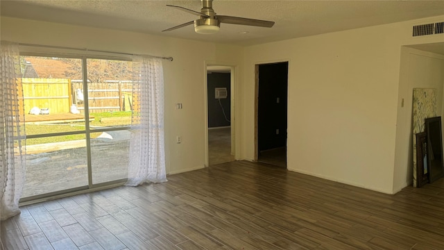 spare room featuring ceiling fan and a textured ceiling