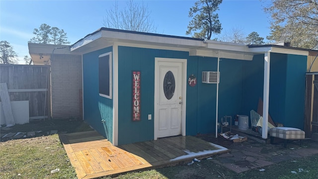 property entrance with a wall mounted AC