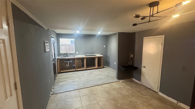 bathroom featuring sink and tile patterned flooring