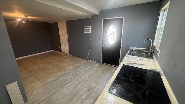 foyer entrance with an AC wall unit and sink