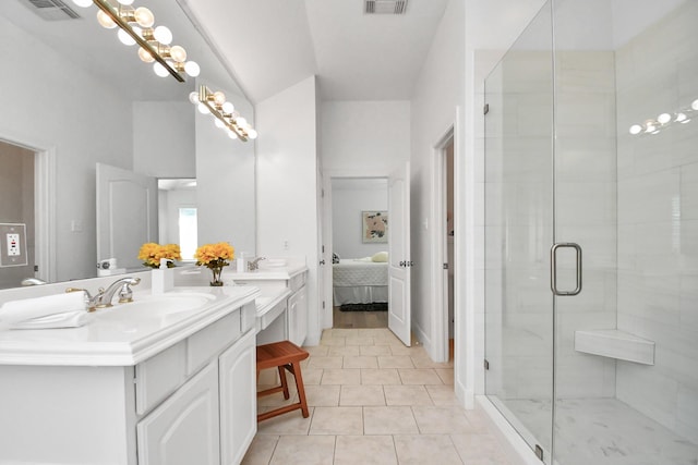 bathroom with vanity, tile patterned flooring, and walk in shower