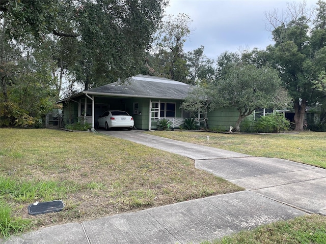 ranch-style house with a front lawn and a carport