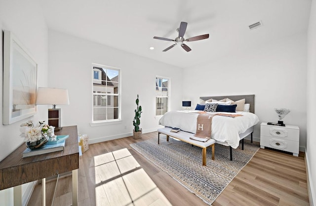 bedroom with ceiling fan and wood-type flooring