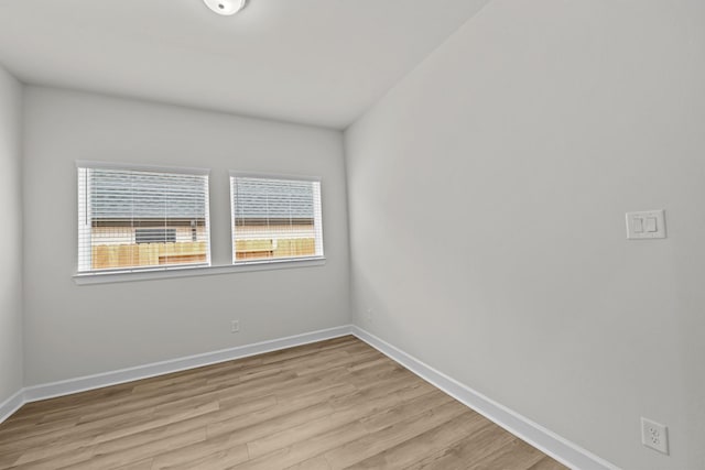 spare room with light hardwood / wood-style floors