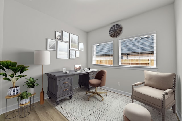 office area with light hardwood / wood-style flooring