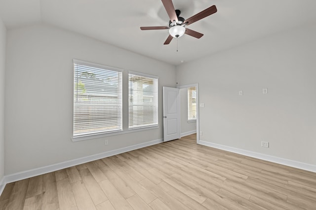 unfurnished room featuring ceiling fan, vaulted ceiling, and light hardwood / wood-style flooring