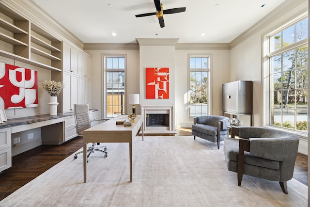 home office featuring ornamental molding, plenty of natural light, and dark wood-type flooring