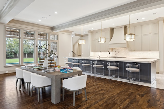 dining space featuring dark hardwood / wood-style flooring and ornamental molding