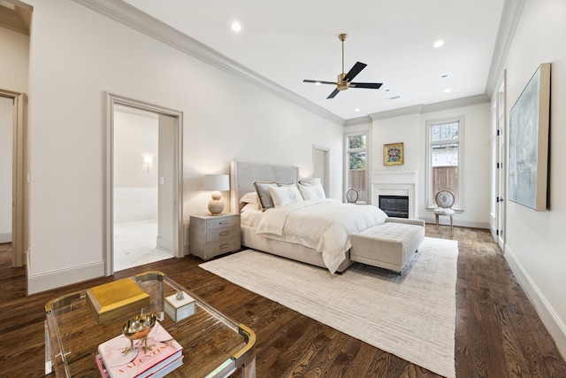 bedroom with hardwood / wood-style floors, crown molding, and ceiling fan