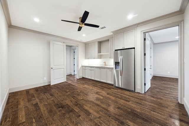 kitchen featuring crown molding, white cabinetry, stainless steel fridge, and dark hardwood / wood-style flooring