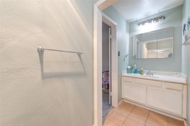 bathroom featuring vanity and tile patterned flooring