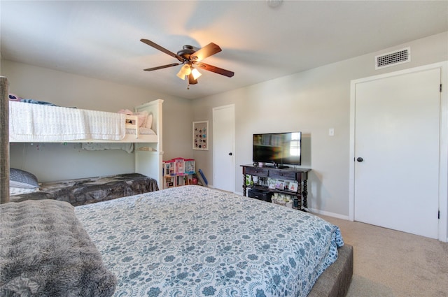 bedroom with ceiling fan and carpet