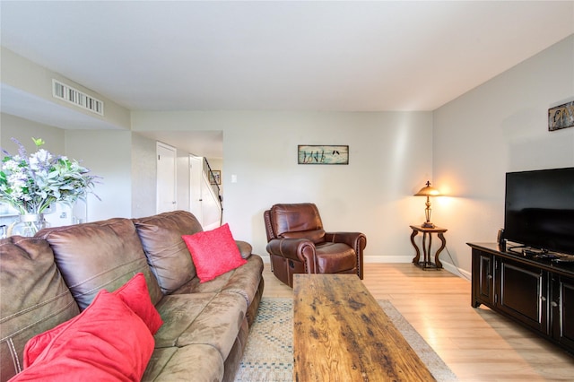 living room with light hardwood / wood-style flooring