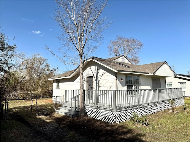 back of property featuring a deck