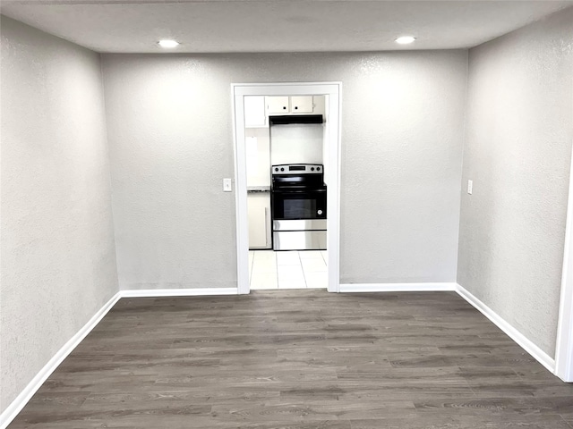 corridor with dark hardwood / wood-style floors