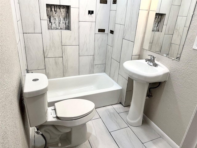 bathroom with toilet and a bathing tub