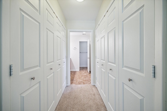 hallway with light carpet