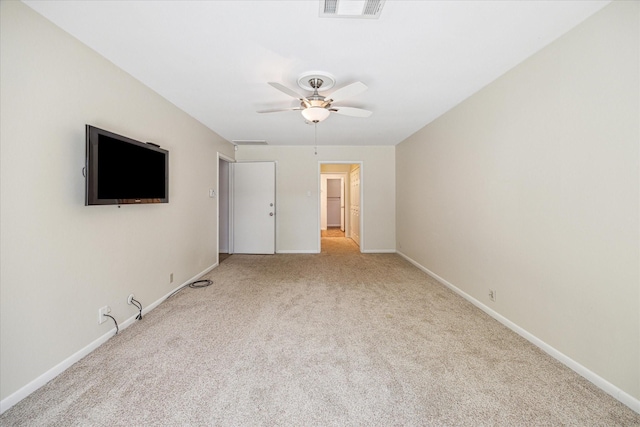 interior space with ceiling fan and light colored carpet