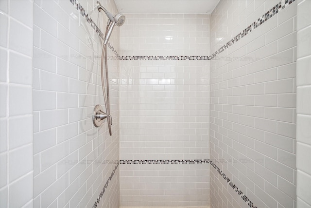 bathroom with tiled shower