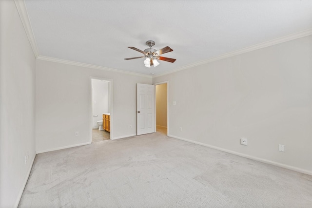 unfurnished bedroom featuring ensuite bathroom, ceiling fan, light carpet, and ornamental molding