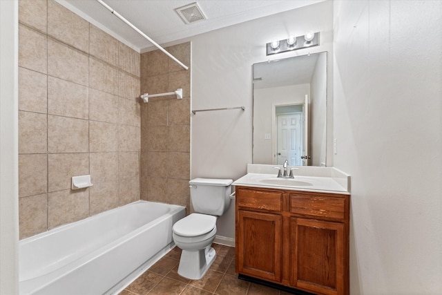 full bathroom with toilet, tiled shower / bath, tile patterned flooring, and vanity