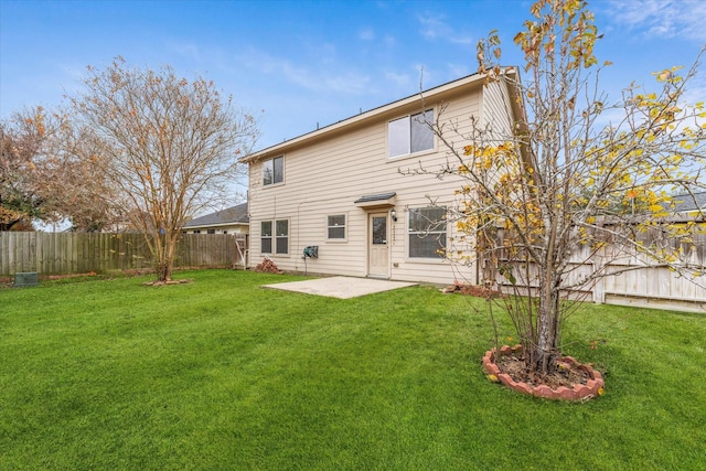 back of property featuring a patio and a yard