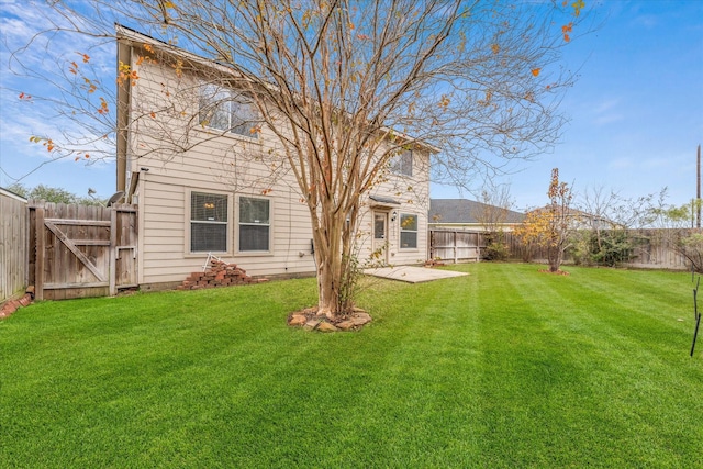 back of property with a lawn and a patio