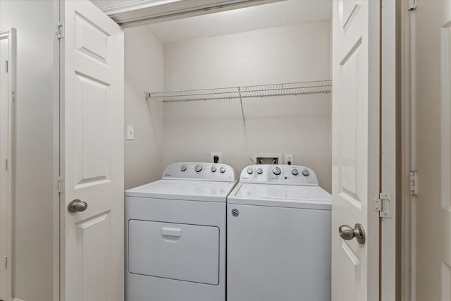 washroom featuring separate washer and dryer